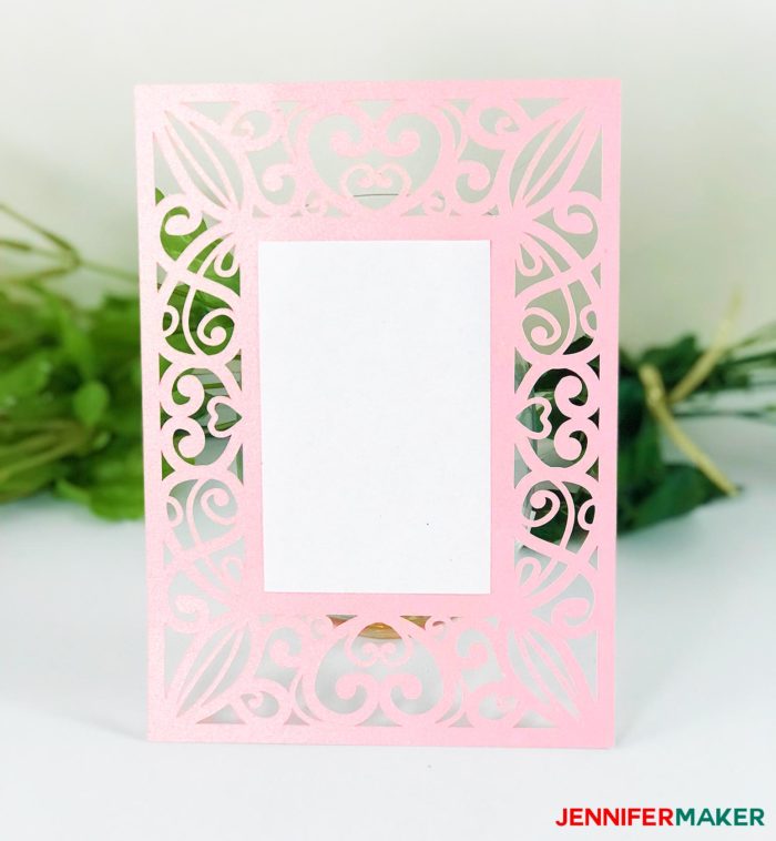 Pink laser cut filigree invitation with gold ribbon for the DIY Wedding Invitation Template Tutorial