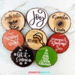 Wood Slice Ornaments painted with acrylic paint and decorated with permanent vinyl