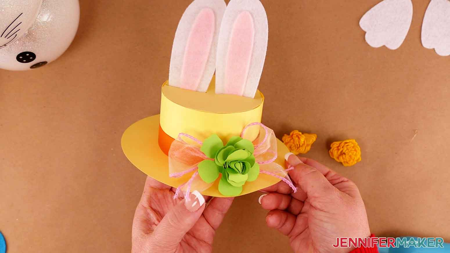 Decorate your bunny hat with ribbon, paper flowers, or other decorations.