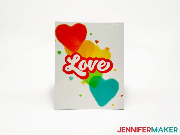 White canvas board from the Dollar Tree with "LOVE" sublimated onto it