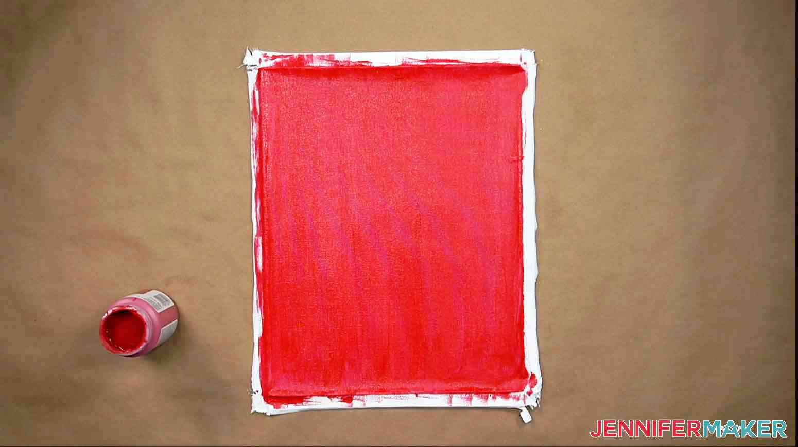 Canvas is painted with red chalk paint for reverse canvas.