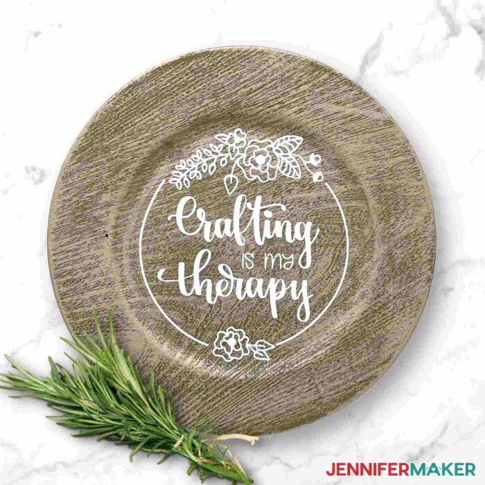 Faux wood grain charger with a "Crafting is my Therapy" decal from Dollar Tree Cricut Projects.