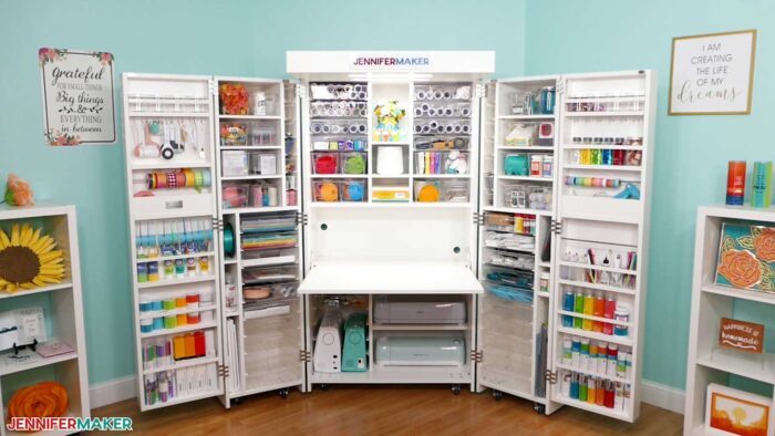 Jennifer Maker's DreamBox 2 craft storage furniture open to reveal lots of supplies and a table.