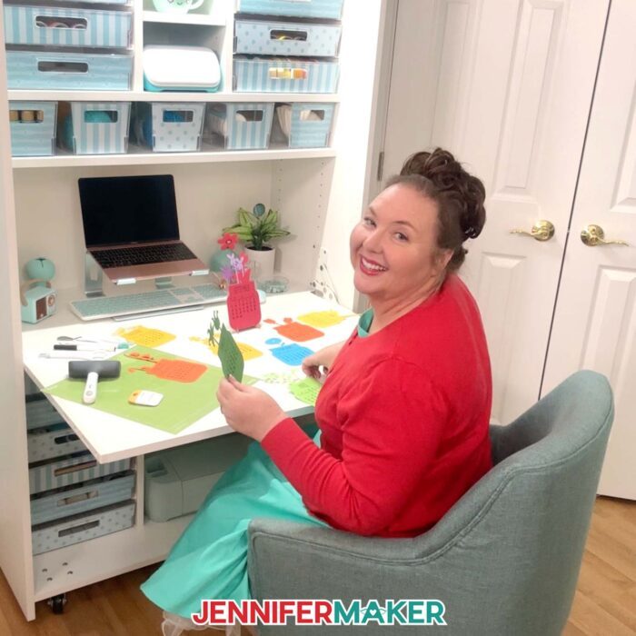 Jennifer Maker sits at her Dreambox Center Table working on a new craft project.