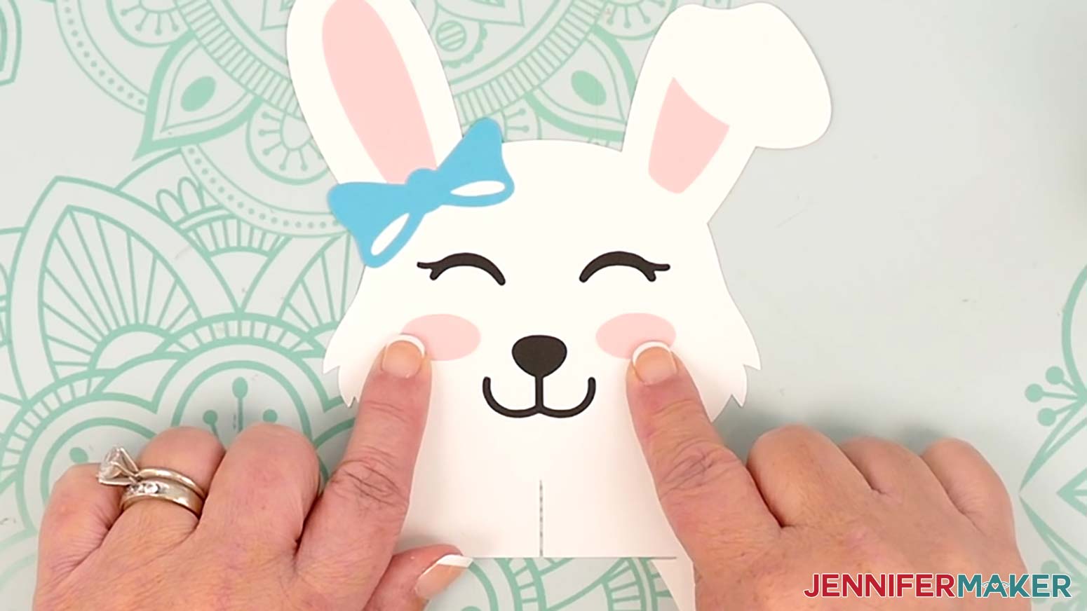 Adhere the oval cheek pieces to the bunny lantern's face, one on each side of the nose.