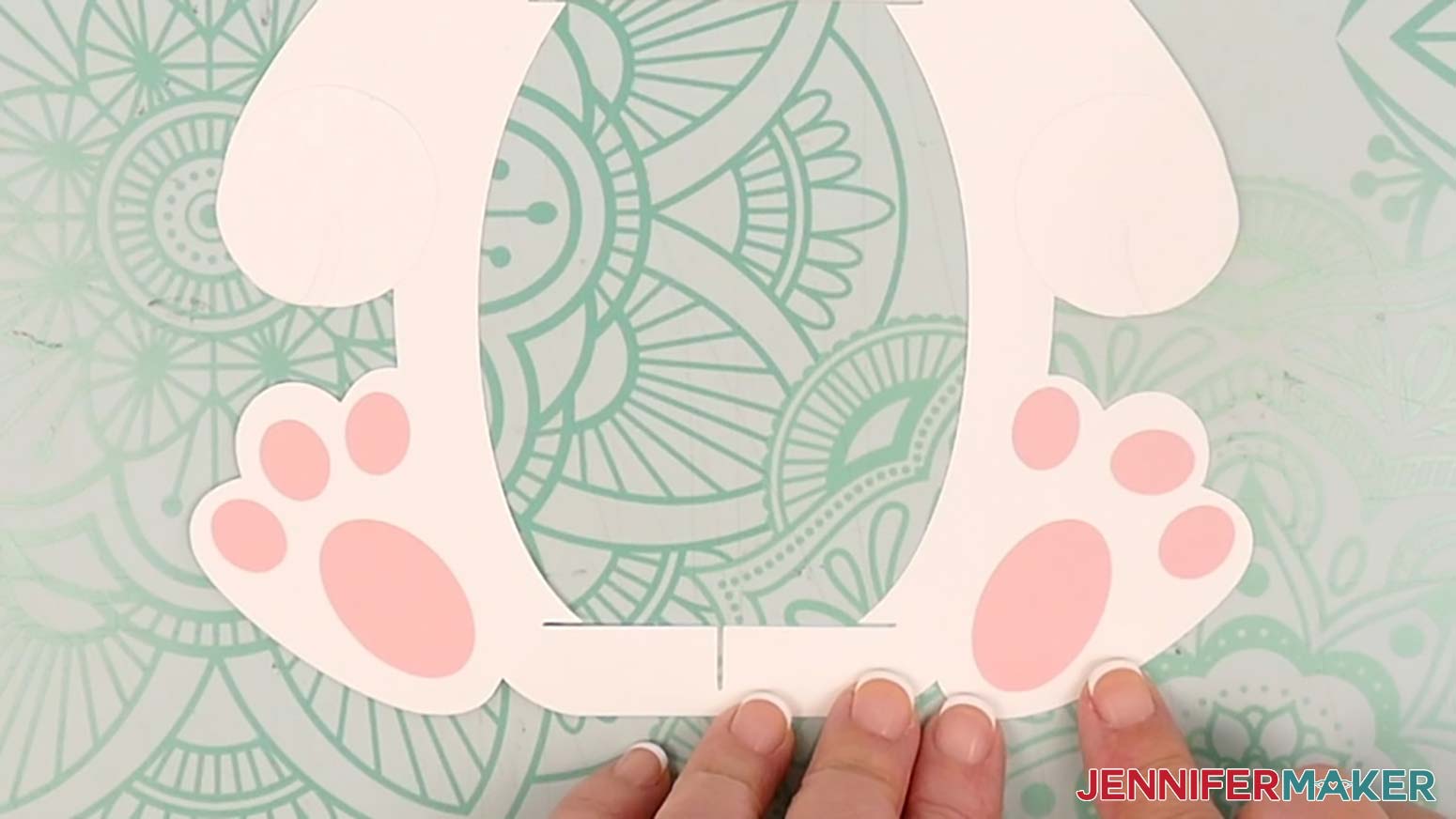 Glue the two large oval pieces to the bunny lantern's left and right feet to create the heels.