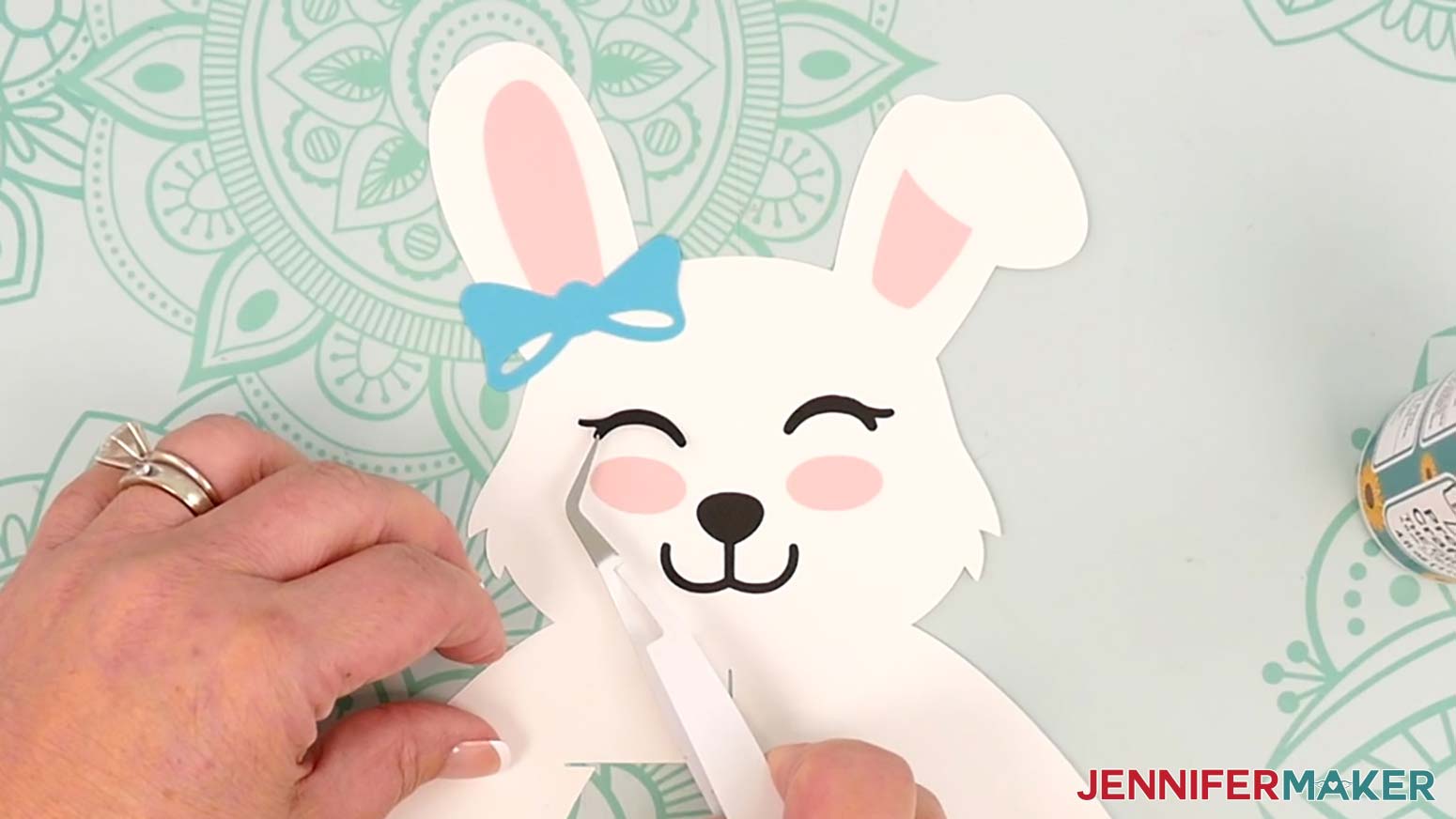 Adhere the left eye to the bunny lantern's face so the eyelash is pointing to the left.