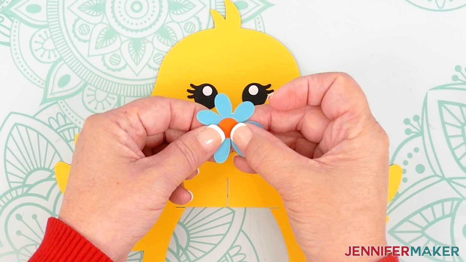 Glue the flower circle in the center of the flower petals before attaching it to the chick lantern's head.