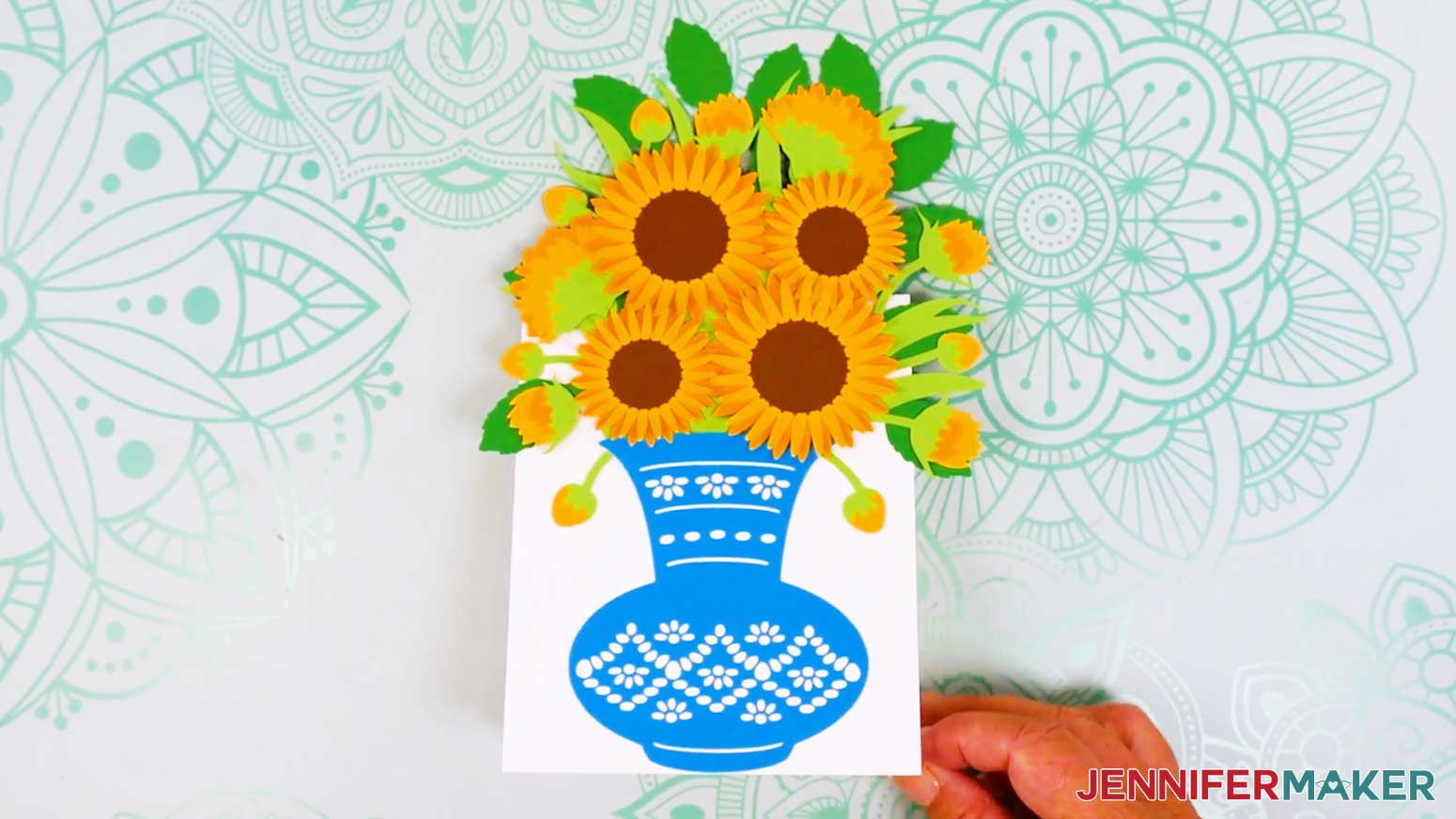 The easy 3d bouquet card is face up on the table showing a finished card that has been fully assembled.