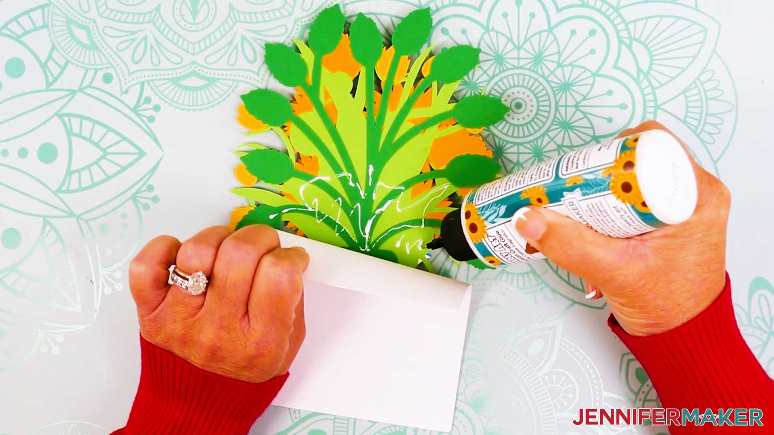 The top of the card base is pulled back slightly to allow for glueing of the back of the foliage to extend to the top of the card base.