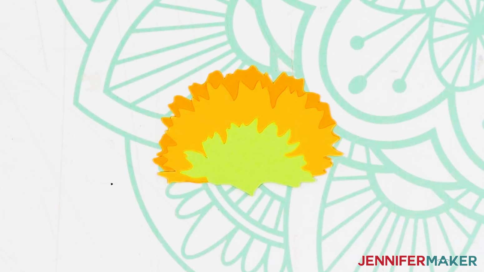 The sideways sunflower is complete with the bottom orange petals and then the middle yellow petals with the green sepal on top.