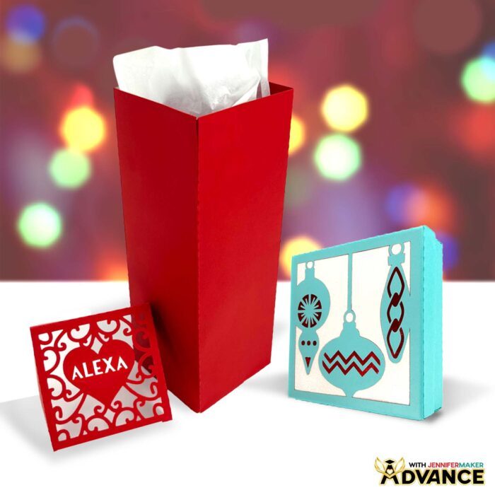 Easy DIY Gift Boxes cut from cardstock for the holidays, with personalized details, against a twinkle light backdrop