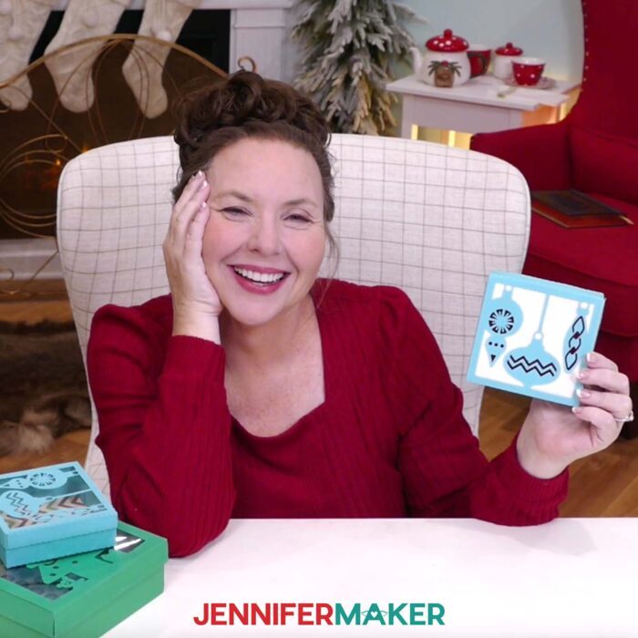 Jennifer holds up a small blue DIY gift box with ornaments on the lid.