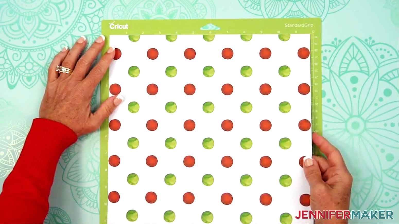 The patterned paper has been applied to the Cricut standard green mat.