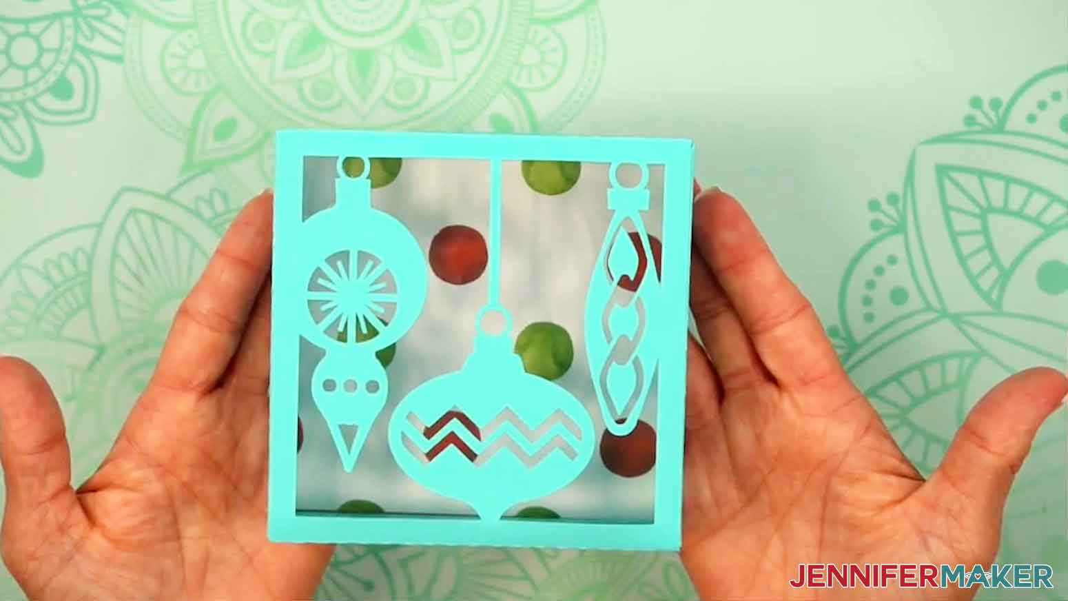 The fully assembled and decorate gift box is shown with the lid on the top of the bottom of the box.