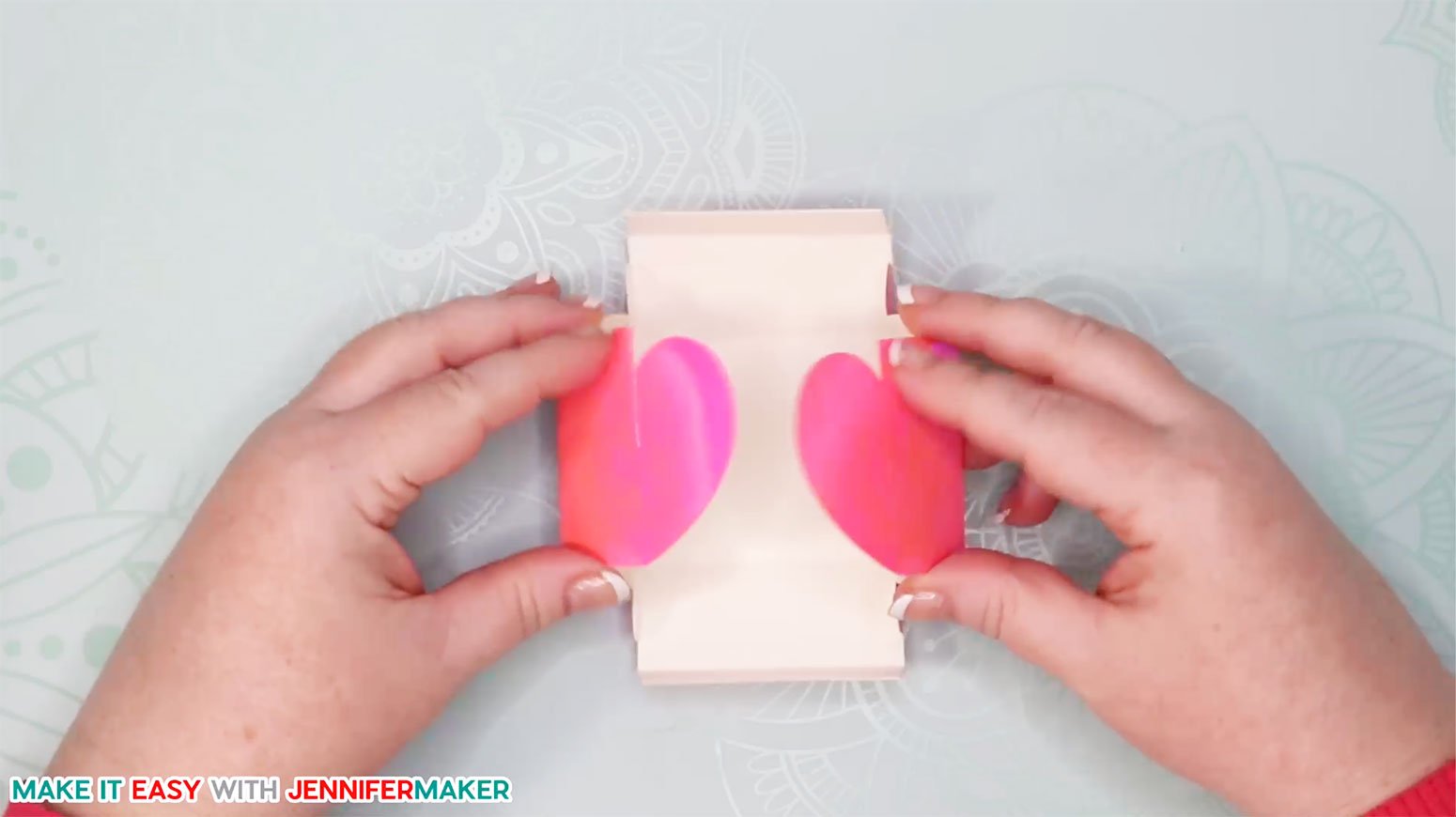 Fold up the easy paper heart box so the two sides meet and slot