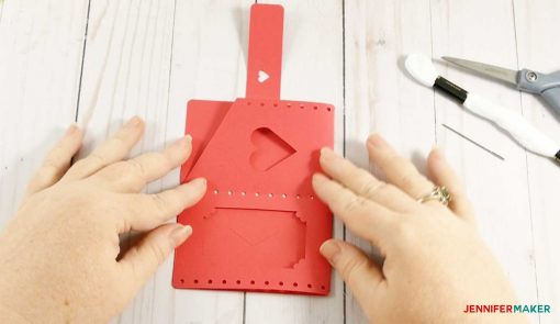 Fold your wallet in half to create the right shape