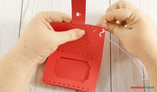 Continue stitching your leather wallet with the embroidery floss