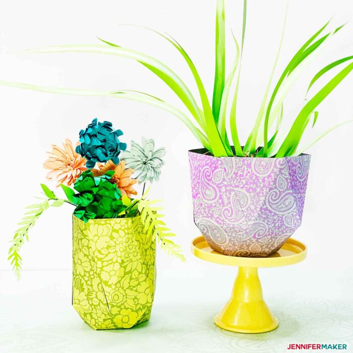 Two pretty and easy paper vases filled with paper flowers and paper plants