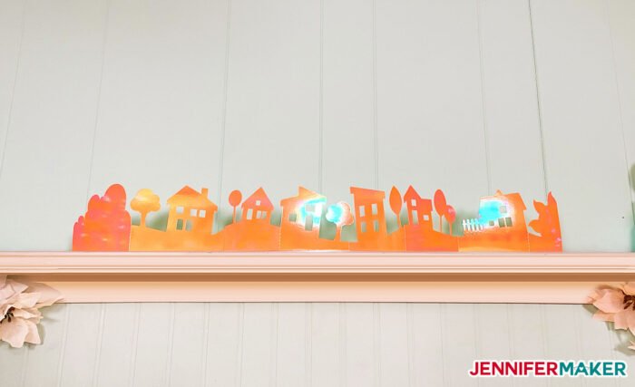 Playful and Easy Paper Village made with orange holographic poster board