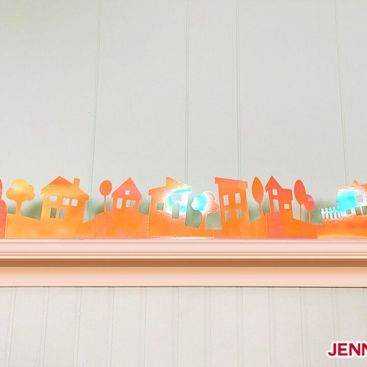 Playful and Easy Paper Village made with orange holographic poster board