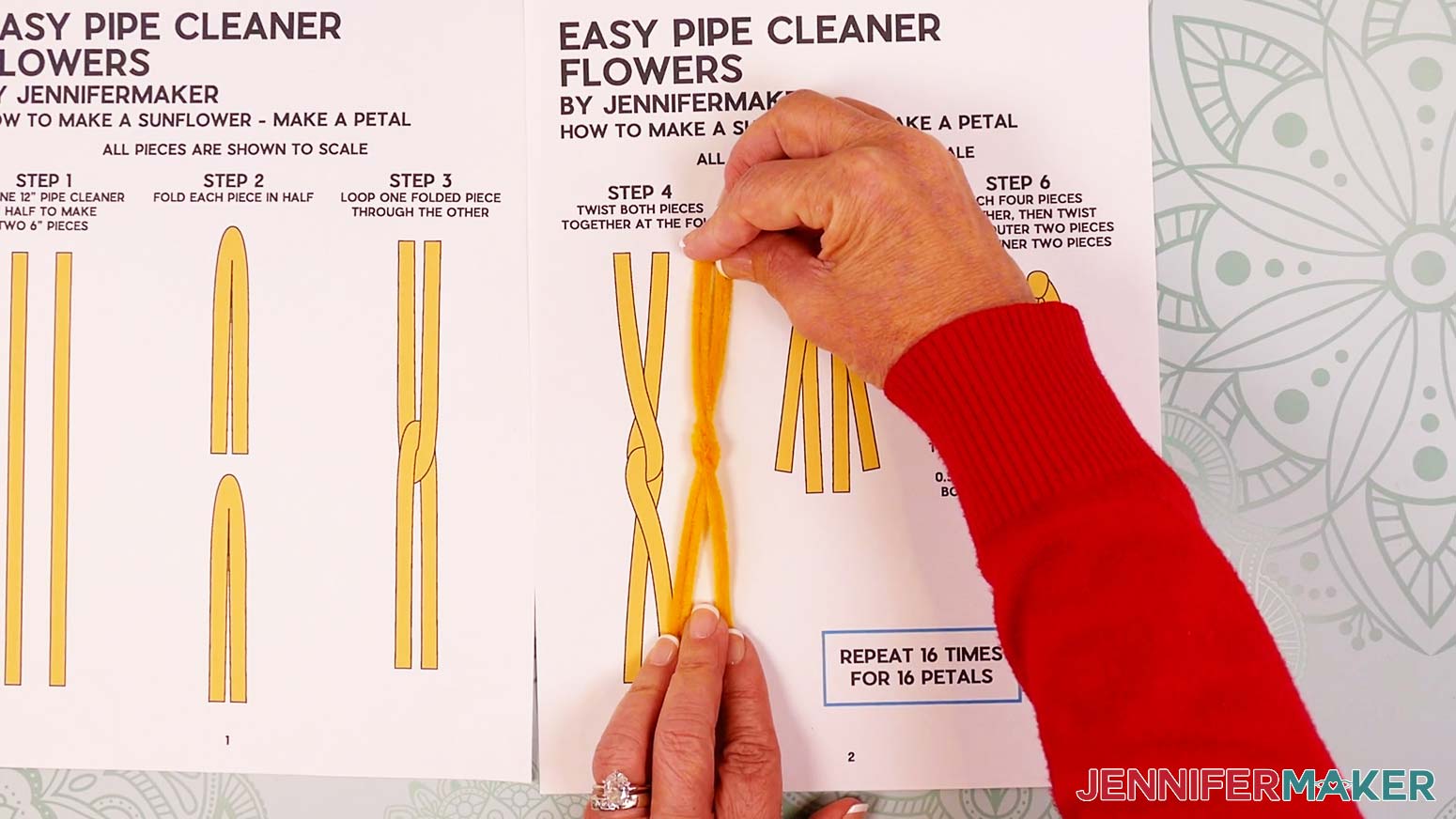 The two linked yellow pipe cleaners next to the reference guide, with a shape that looks like a skinny X.