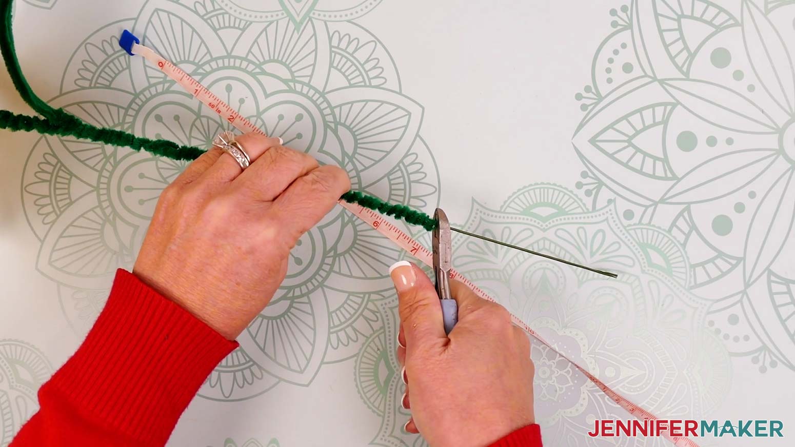 Hold the stem and floral wire and use wire cutters to trim off the excess wire.