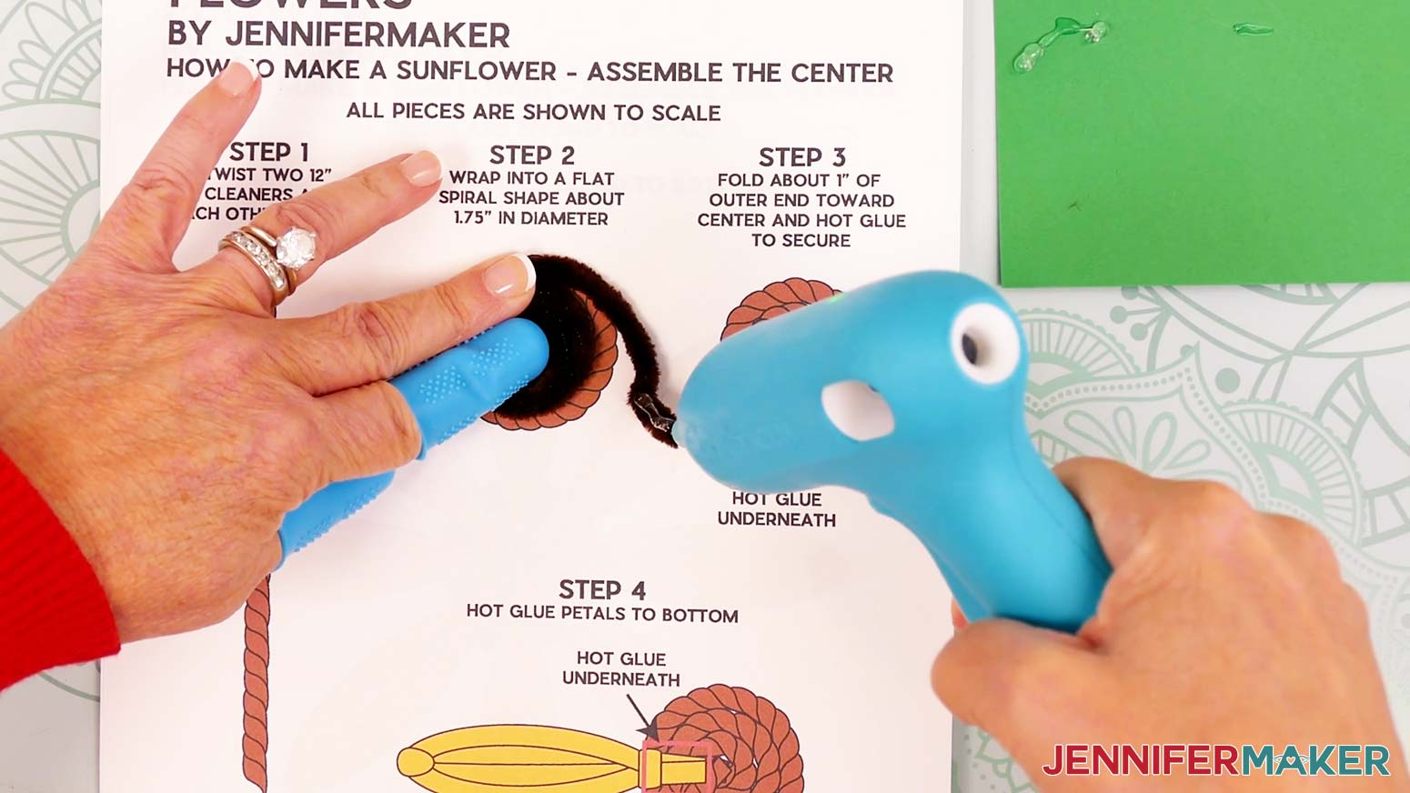 Lift the folded section up and add hot glue to its underside.