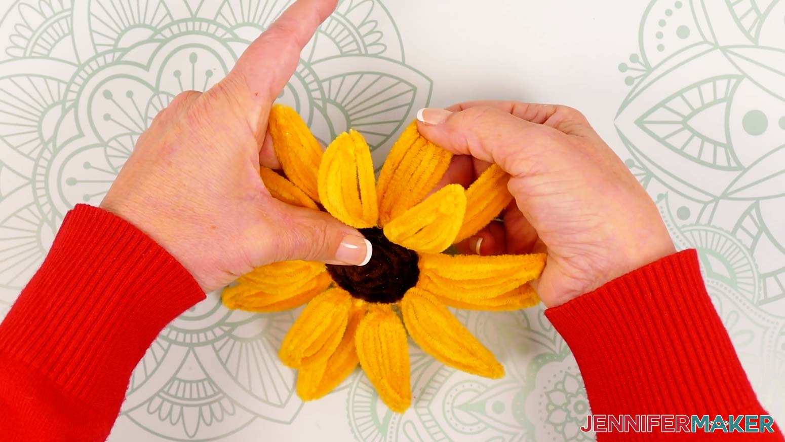 Gently curve the second set of eight sunflower petals with a less dramatic arch.