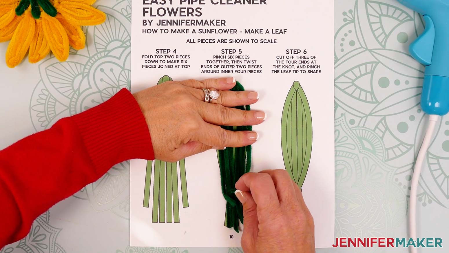 Fold the outer pipe cleaner legs at 90° angles so they cross the middle legs about 1.5 inches from their ends.