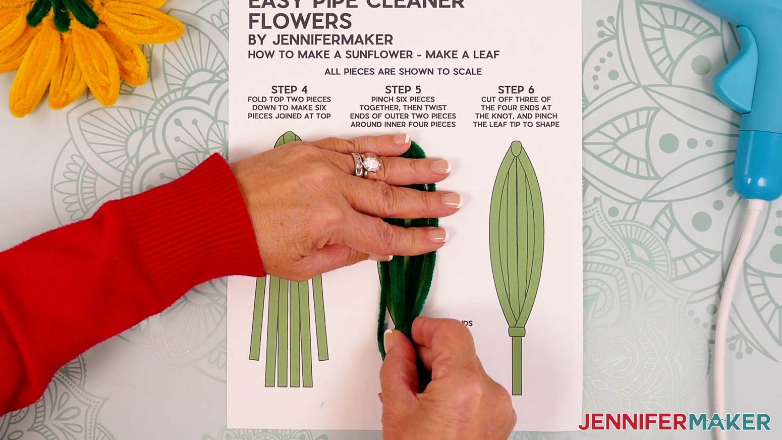 Use the shorter folded pipe cleaner section to wrap around the middle legs for the leaf shape.