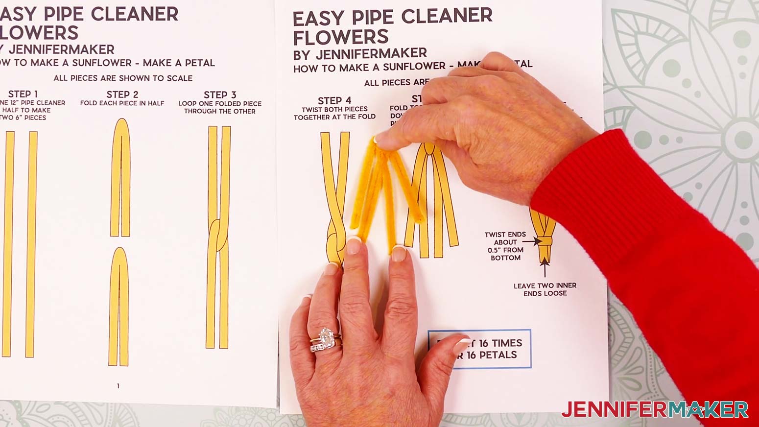 Keep the lower pipe cleaner petal legs still, and fold the upper legs down to either side.