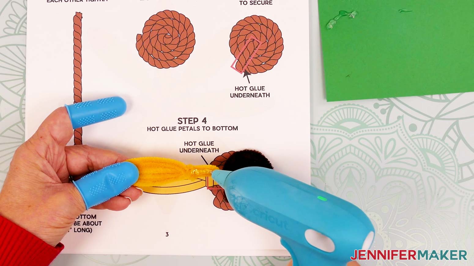 Add hot glue to the pipe cleaner petal’s front from the wrapped section to the ends of the legs.