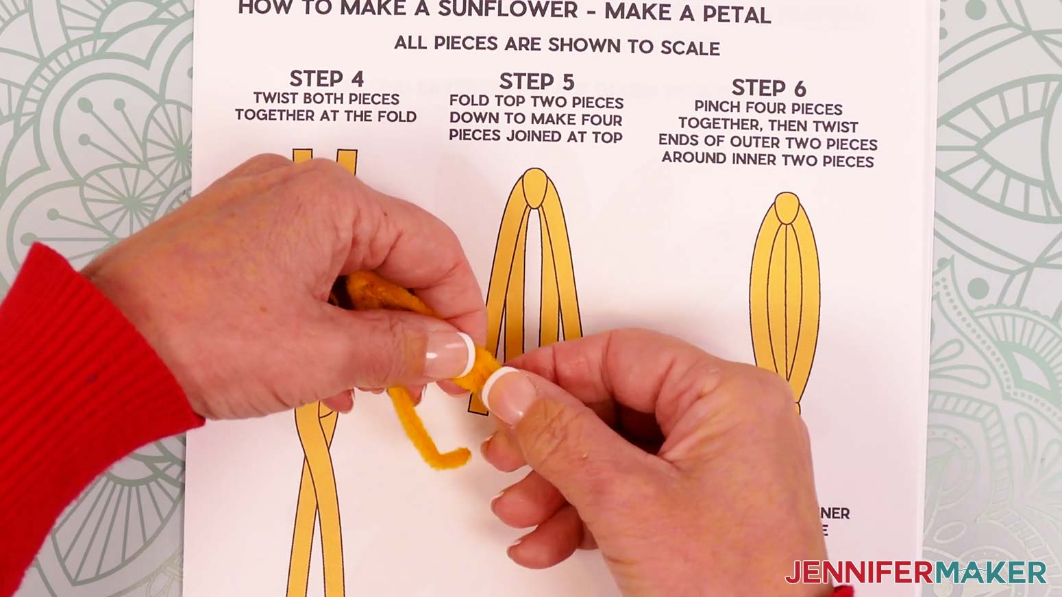 Use the shorter folded pipe cleaner section to wrap just around the two middle legs.