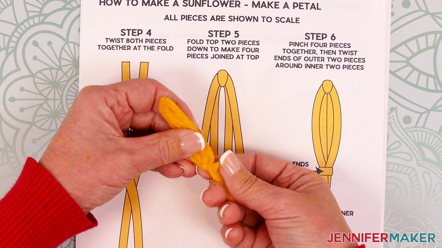 Use the remaining folded pipe cleaner section to wrap around the two middle legs at the same spot.