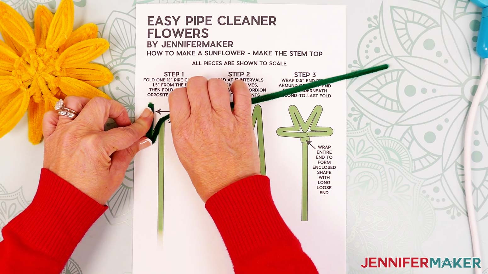 Fold a 12” green pipe cleaner about 1.5” down from one end.