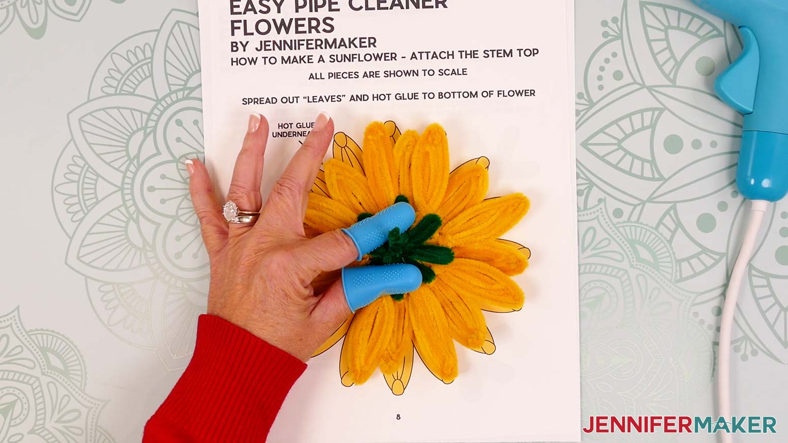 Press the glued leaves in place on the pipe cleaner sunflower's back side.