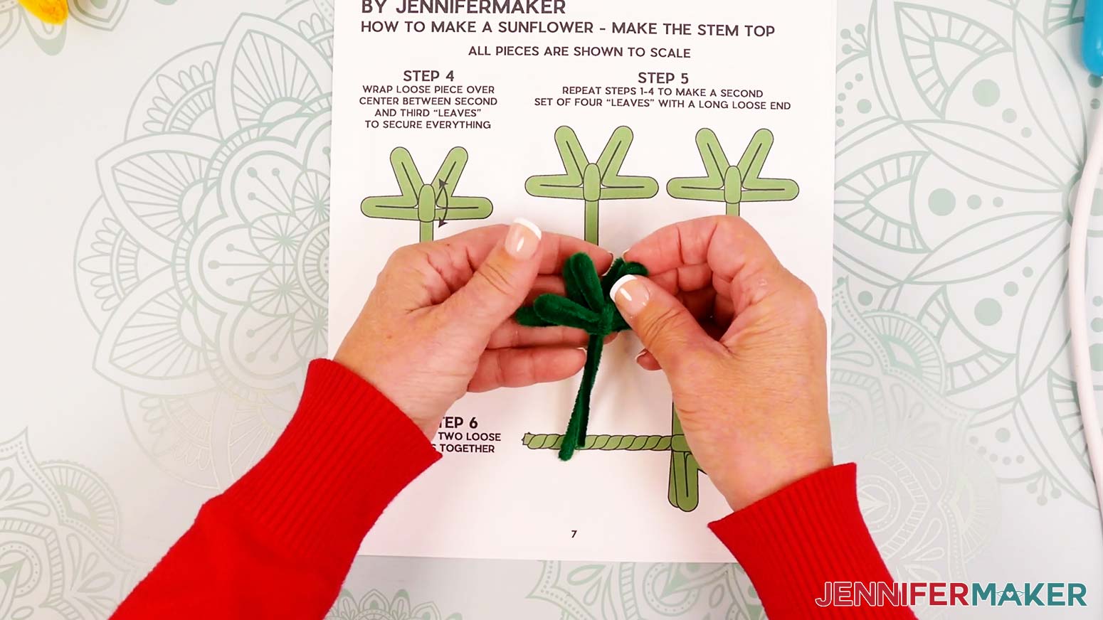 Stack the green pipe cleaner stem sections one on top of the other so their joints are at the same spot.