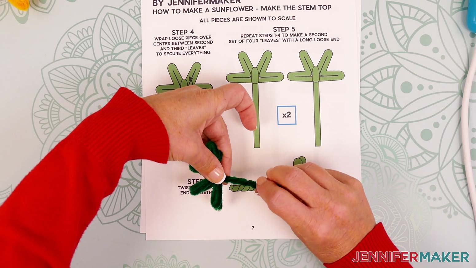 Hold the pipe cleaner stem sections at the joint and tightly twist the loose stems together.