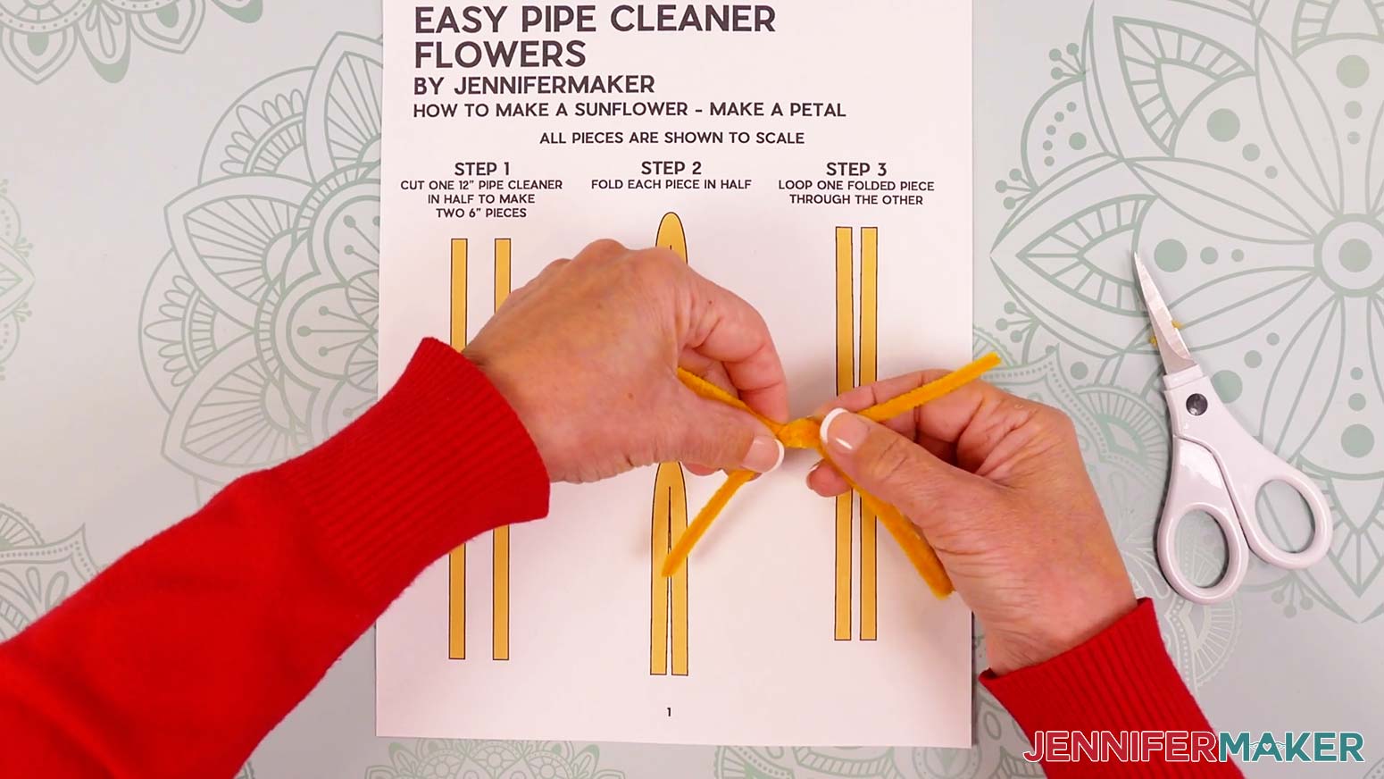 Close to the joint, twist the legs of both pipe cleaners in opposite directions once to secure them together.