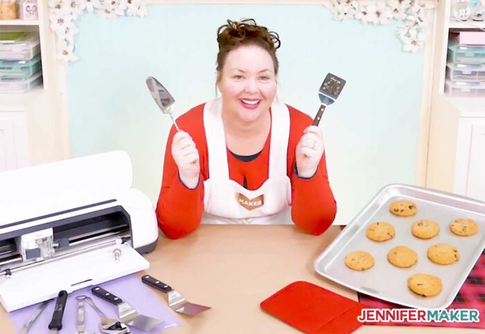 Jennifer with an engraved cookie spatula made on her Cricut Maker