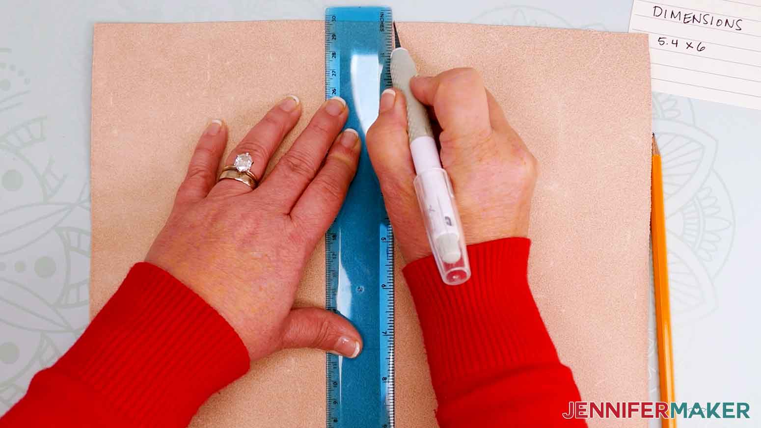 Use the True Control knife to cut leather along marked measurements.