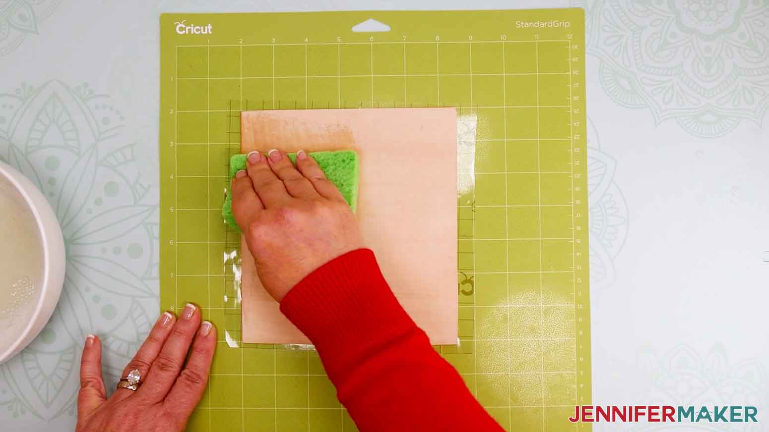 Use a kitchen sponge to dampen the leather before engraving.