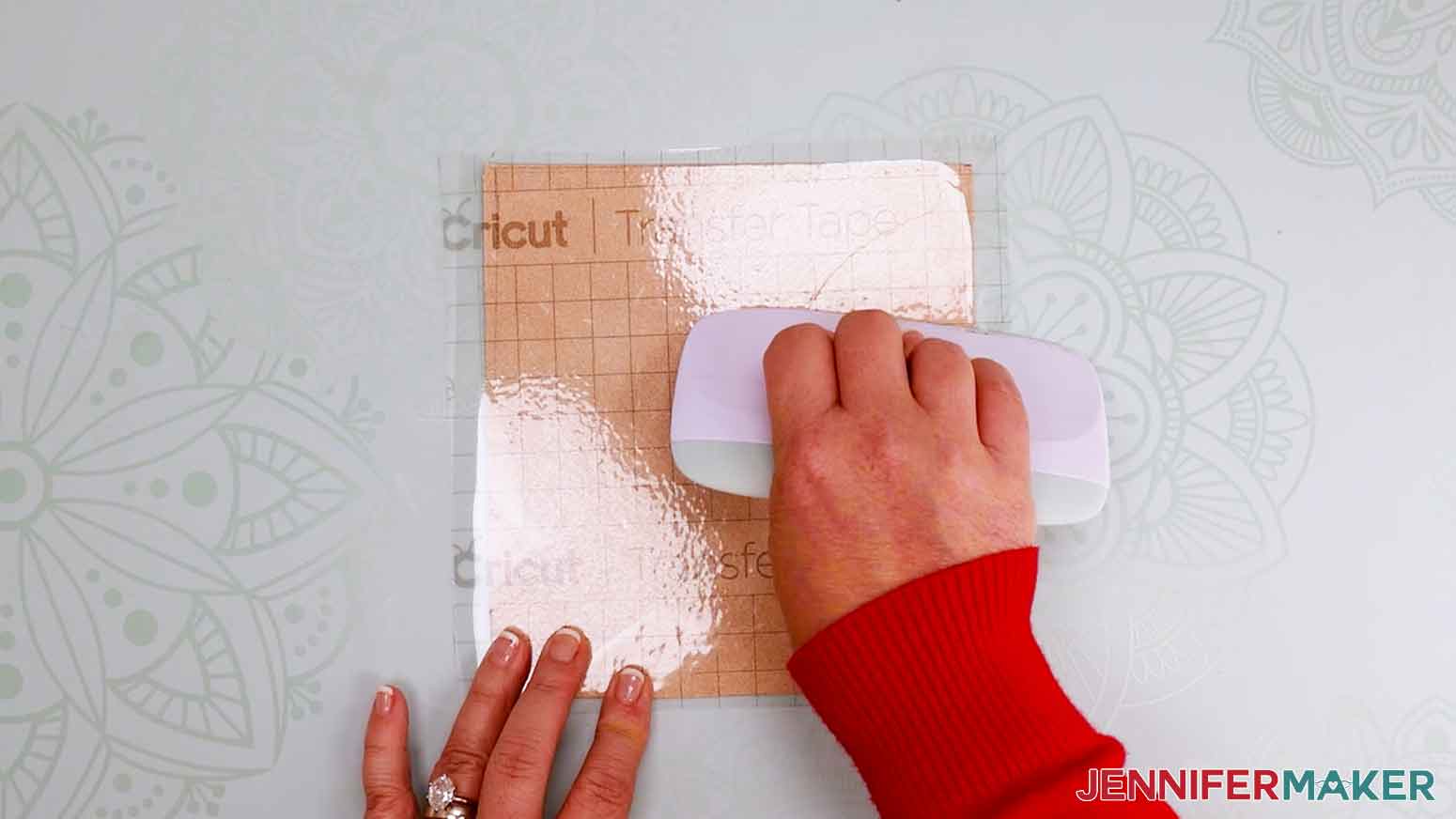 Use a scraper tool to adhere transfer tape to the back side of the leather.