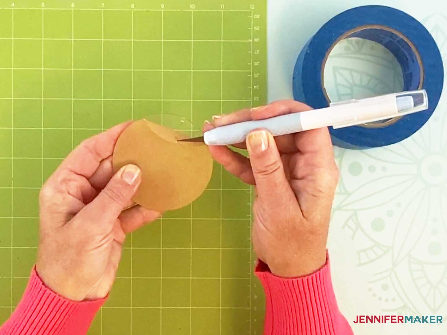 Use a knife blade to help remove the protective backing from the acrylic for my engraved ornaments