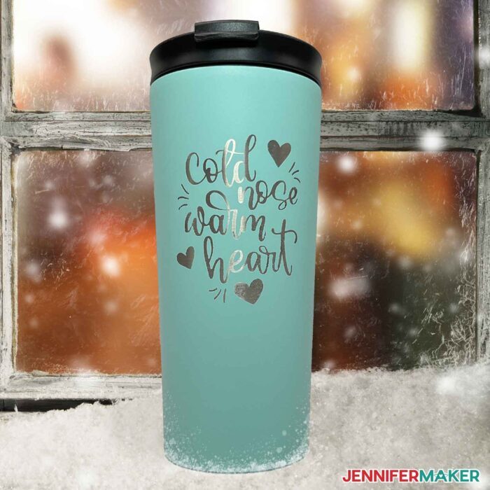 Blue metal tumbler with a decorative Cold Nose Warm Heart design etched in the coating using Citristrip.