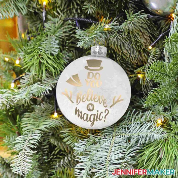 Glass ornament etched with a "do you believe in magic?" design