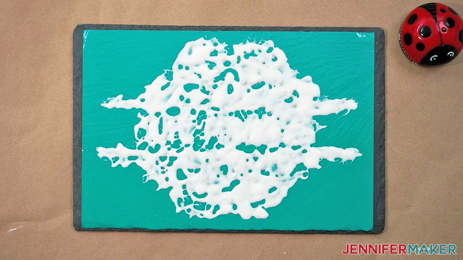 Etching cream applied to the entire cheeseboard stencil design for the Etched Slate project.