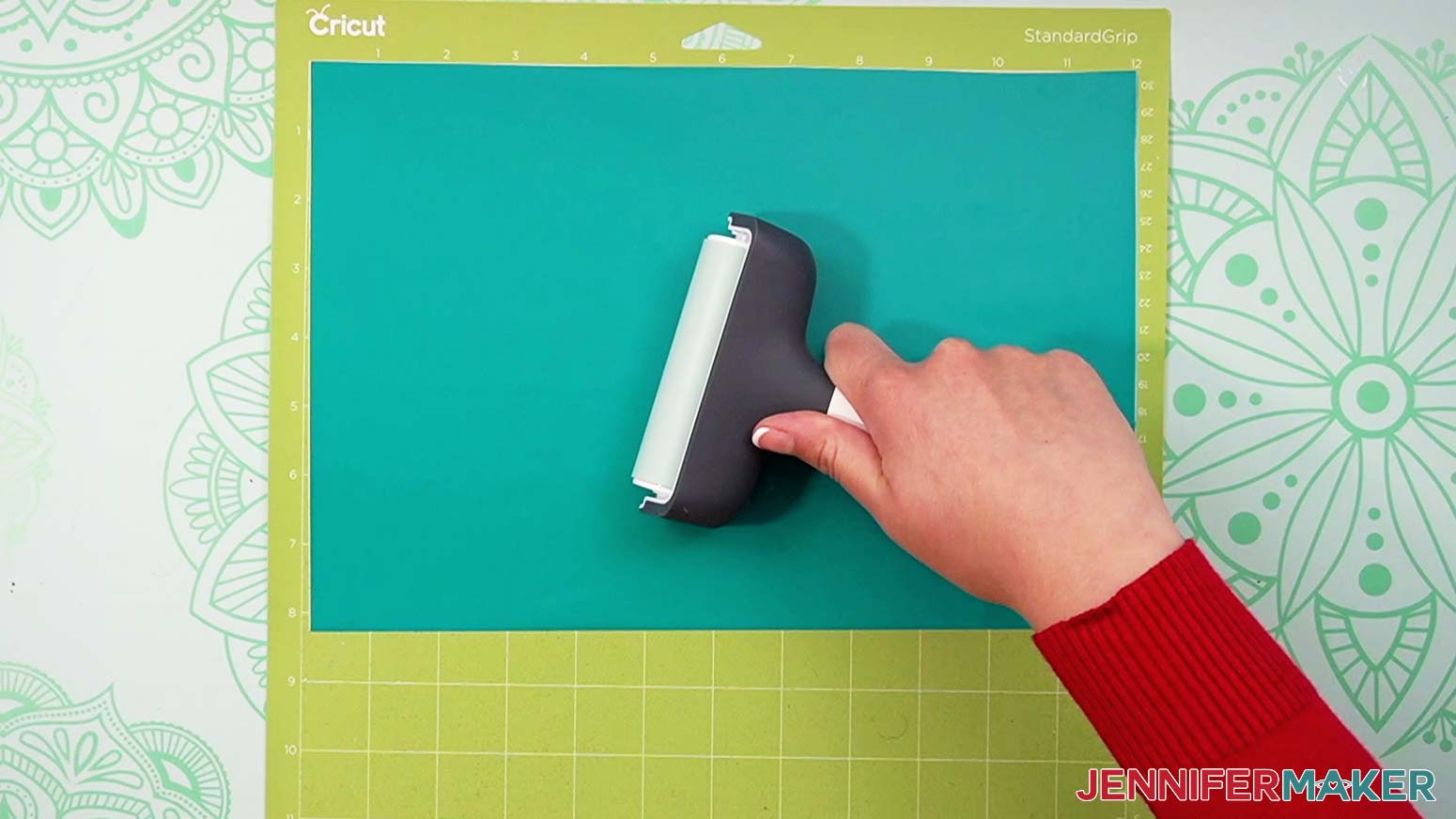 Use a brayer to fully adhere permanent vinyl to a green machine mat.