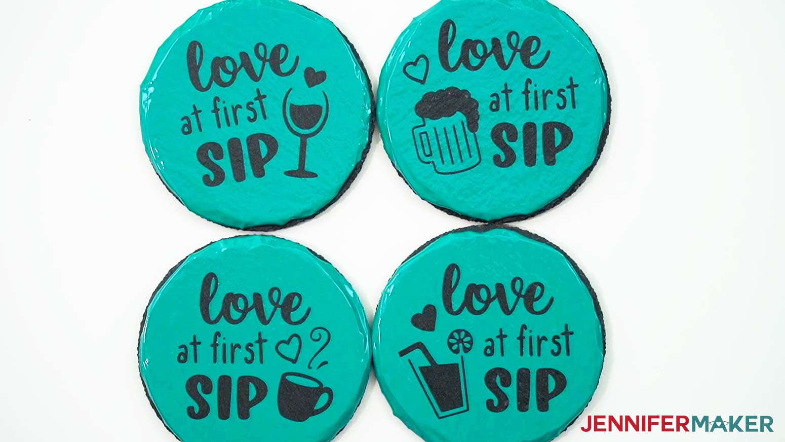 Four slate coasters with teal permanent vinyl stencils properly adhered so etching cream can be used on them.
